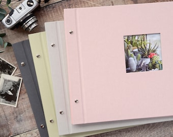 High Quality Linen Screw Bound Expandable Photograph Album with opaque glassine interleaves. 39x31cms. 20 pages / 40 sides. 4 colour choices