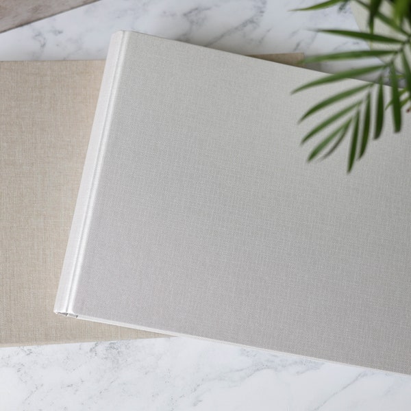 High Quality Plain Photo Guest Book with hidden spiral. Pearlescent Ivory or Natural Linen. 25 pages / 50 sides or 35 pages / 70 sides.