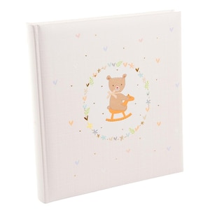 May include: A pink photo album with a white border and a brown bear riding a rocking horse in a floral wreath. The background is a light pink with small white hearts.