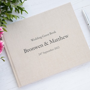 Personalised High Quality Wedding Guest Book.  Simple classy text design. 50 plain white pages / 100 sides. 13 book colour choices.