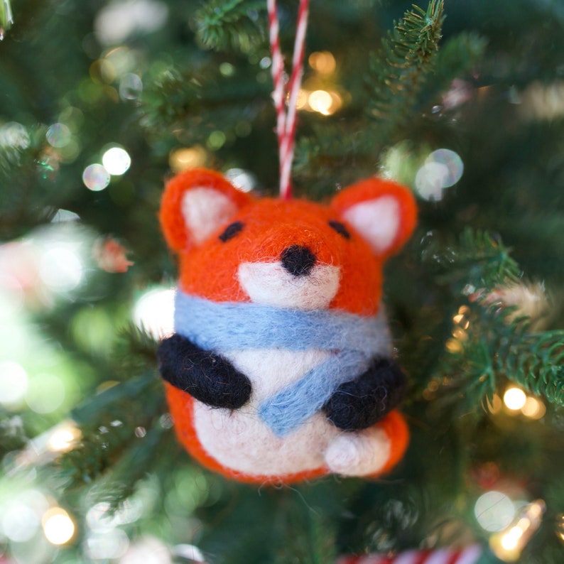 chubby fox ornament hanging on a Christmas tree, a handmade fair trade holiday decor item from Ornaments 4 Orphans