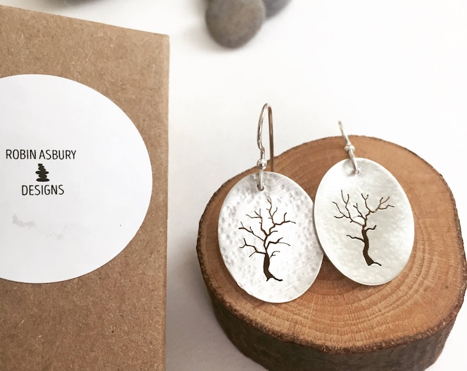 hand pierced sterling tree earrings with silver bead.