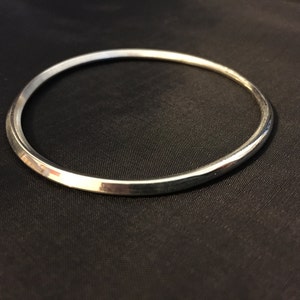 Hand forged sterling silver bangle square to round