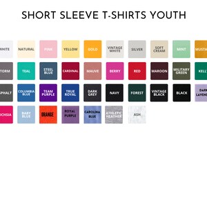 May include: Image displays a color chart for youth short sleeve t-shirts. The chart features a variety of colors, including white, pink, yellow, gold, red, black, and more. The text "SHORT SLEEVE T-SHIRTS YOUTH" is at the top.