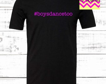 May include: Black t-shirt with the text "#boysdancetoo" in pink.