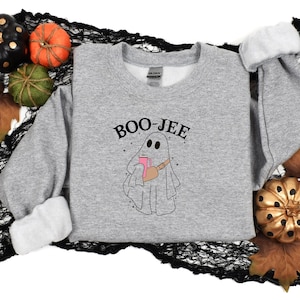 May include: Gray sweatshirt with a ghost holding a pink mug and the text "BOO-JEE" in black.