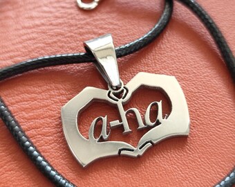 A-ha Stainless Steel Charm Necklace: Limited Edition Leather Cord Pendant