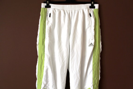 white and green adidas pants