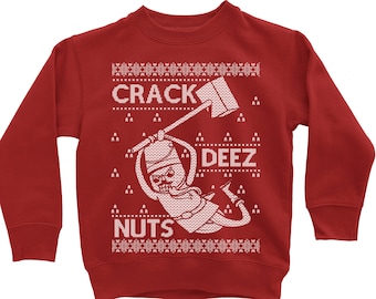 May include: Red Christmas sweater with a white design of a cartoon character holding an axe and the text "Crack Deez Nuts".