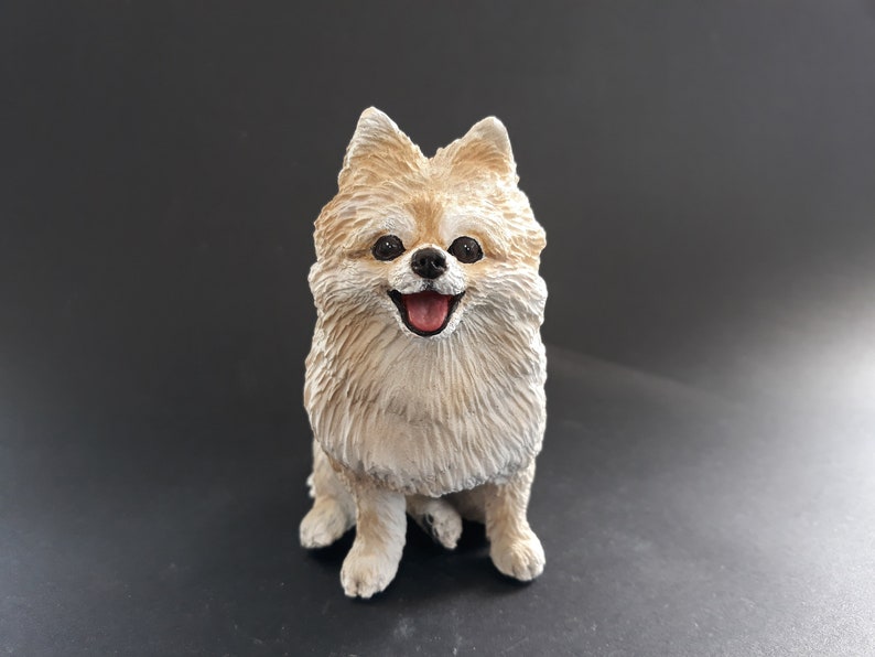 pomeranian statue with wings