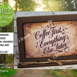 May include: A framed wood print with the text "Coffee First, Everything Else Later." The brown frame holds a vintage-style print with coffee bean accents. The sign measures 7.5" x 5.25" and is from Clesson Woods Studio.