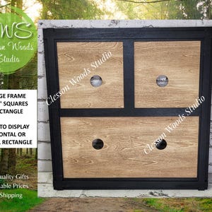 May include: A collage frame with a black frame and light brown wood grain panels. It features two 4.25-inch square openings and one rectangular opening. The frame includes circular cutouts and can be displayed horizontally or vertically.