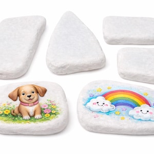 May include: White painted rocks in various shapes. Two rocks are decorated with colorful illustrations: a puppy in a field of flowers and a rainbow with smiling clouds. The other rocks are plain.
