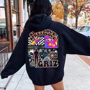 May include: Black hoodie with a graphic print on the back. The graphic features a psychedelic design with the text "Spread Love" and the name "GRIZ".