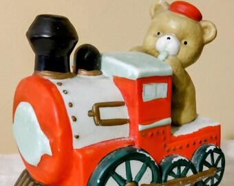 All Aboard the Teddy Train. Beautiful Hand Painted Porcelain Locomotive. Features Wind Up Music Box Playing "Santa Claus is Coming to Town"