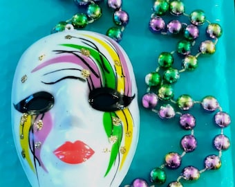 MARDI GRAS--Handcrafted mask 4" x 3" w/colors of Carnival & glitter!  36-in metallic beads of purple, green and gold attached.  Stunning.
