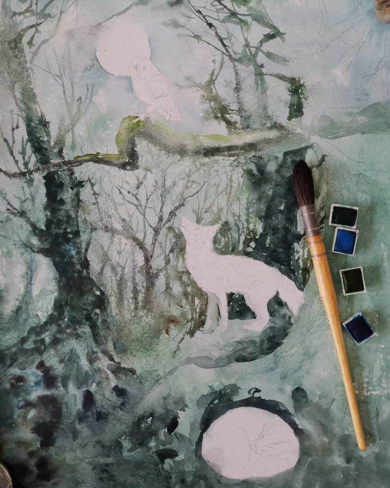 May include: Watercolor painting in progress, depicting a moonlit forest scene. A white wolf howls at the moon, with an owl perched on a branch. A sleeping fox is at the bottom. A paintbrush and paint palette are in the image.
