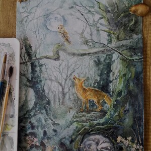 May include: Watercolor painting of a moonlit forest scene. A fox stands on a rock, looking up. An owl perches on a branch, and a badger sleeps in a hollow. The artwork features muted greens, blues, and browns, with a full moon in the background.