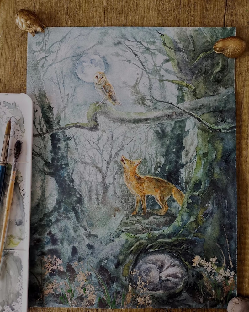 May include: Watercolor painting of a moonlit forest scene. A fox stands on a rock, looking up. An owl perches on a branch, and a badger sleeps in a hollow. The artwork features muted greens, blues, and browns, with a full moon in the background.