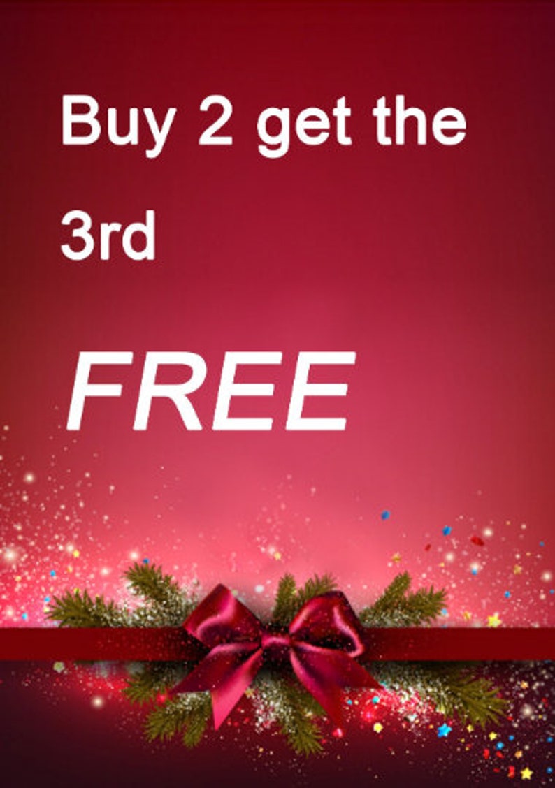May include: A festive promotional graphic with a gradient red background. White text reads "Buy 2 get the 3rd FREE". A red ribbon and bow with pine branches and sparkling confetti complete the design.