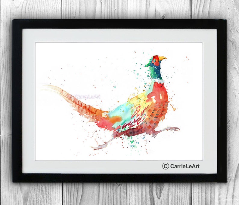 May include: A framed watercolor print of a pheasant in motion. The bird features vibrant colors including red, orange, yellow, green, and blue. The artwork is signed "CarrieLeArt" in the lower right corner.