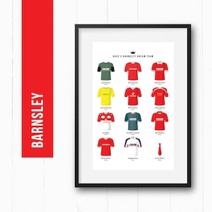 May include: A framed print displaying a selection of football shirts, each with distinct designs and colours. The shirts are arranged in rows, with player names beneath. A red banner on the left reads "BARNSLEY".