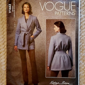 May include: Vogue Patterns sewing pattern for a jacket with a wrap style collar and a belt. The pattern is for sizes X-Small (4-6), Small (8-10), and Medium (12-14). The pattern is by Kathryn Brenne.