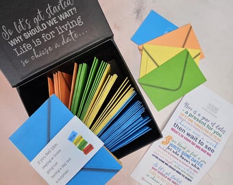 A Box of Date night ideas by A Year of Dates. A paper wedding anniversary gift for him. A romantic Wedding gift suitable for any couple
