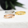 Stainless Steel Initial Ring with Heart: Personalized Couple's Jewelry product logo