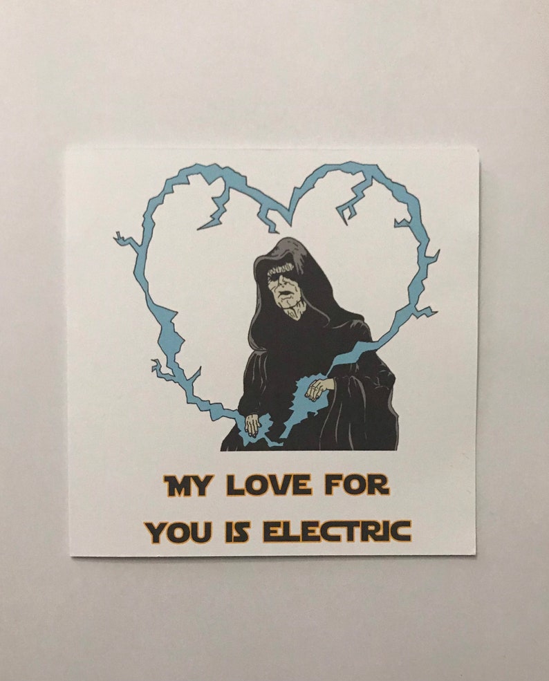 May include: Square white card featuring a cartoon illustration of a cloaked figure within a blue lightning bolt heart. The text reads "MY LOVE FOR YOU IS ELECTRIC" in gold lettering. The image is a pop culture reference.