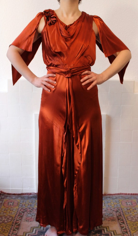 1930s rusty satin gown with lamé appliqué flowers and… Gem