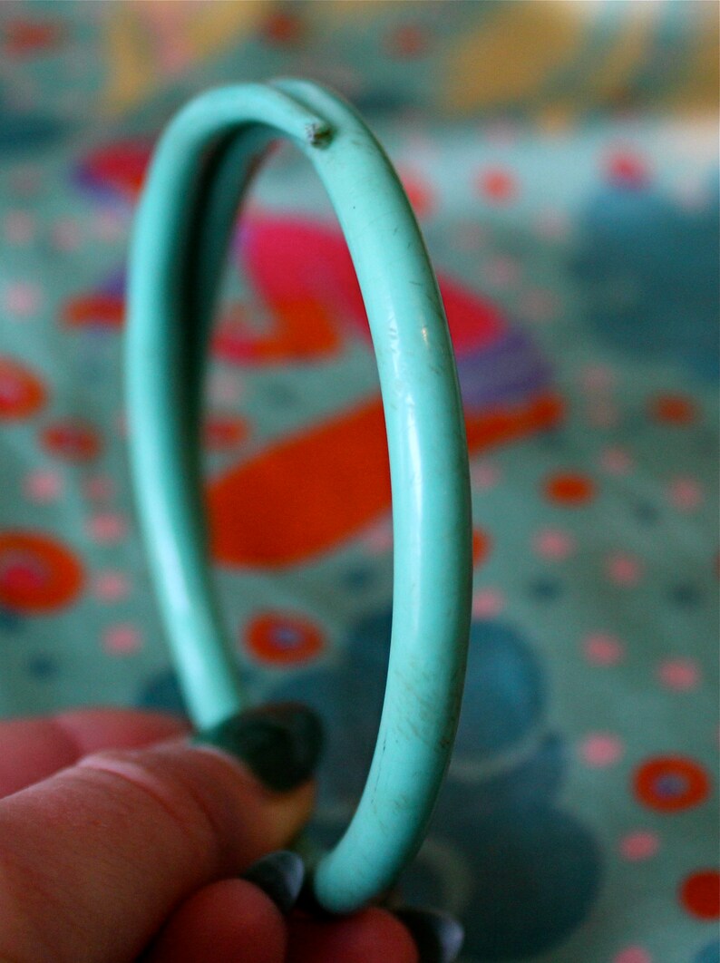 20s plastic turquoise serpent bangle with rhinestone eyes and carved happy smile 1920s celluloid smiling snake bracelet