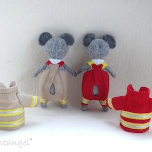 In this picture: two handmade felt koala bears, both dressed as a firefighter, one in a red costume, the other in a sand-colored costume. all clothing has refelcting stripes in yellow and silver. All is made with a PDF handsewing pattern from WoolFeltWonders, part of a series with toy animal and clothing patterns to mix and match, to portray hobby or profession for play.