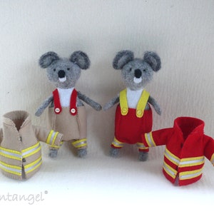 In this picture: two handmade felt koala bears, both dressed as a firefighter, one in a red costume, the other in a sand-colored costume. all clothing has refelcting stripes in yellow and silver.  All is made with a PDF handsewing pattern from WoolFeltWonders, part of a series with toy animal and clothing patterns to mix and match, to portray hobby or profession for play.