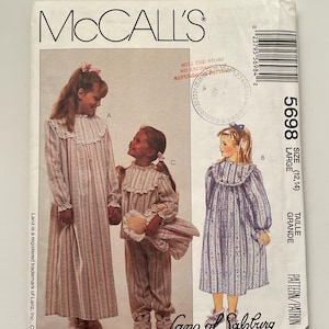 May include: McCall's sewing pattern 5698 for nightgowns and pajamas in size Large (12, 14). The envelope features illustrations of three children wearing long-sleeved, ruffled sleepwear in striped and floral patterns, with the Lanz of Salzburg logo.