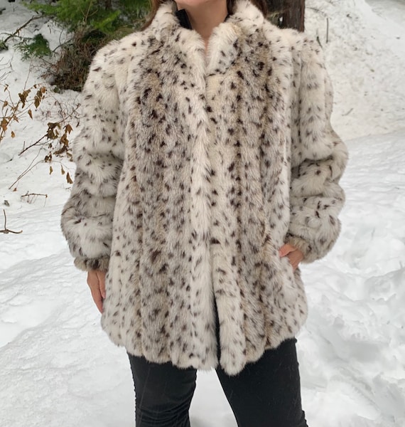 white leopard fur coat