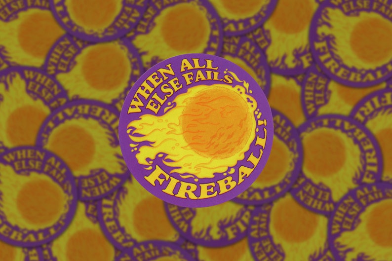 A round sticker with an illustration of a fireball on a purple background. Above the illustration are the words "When All Else Fails" and underneath is the word "Fire".