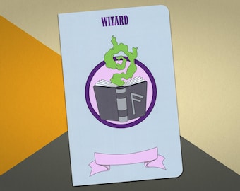 May include: A blue notebook with the word "WIZARD" printed on the front. The notebook features a purple circle with a green cloud and a closed book with a rune symbol.