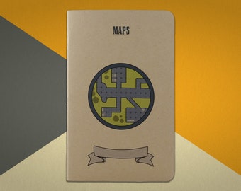 May include: A brown notebook with the word "MAPS" printed on the front cover. A circular map with a green background and gray lines is featured on the cover. A white ribbon with a gray border is below the map.
