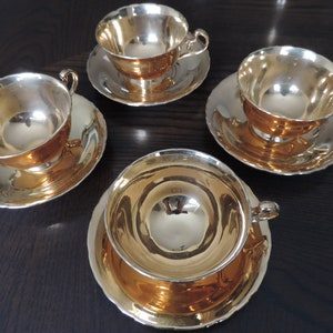 Set of four cups and saucers -Royal Winton - gold