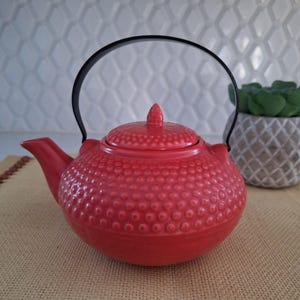 Red ceramic teapot