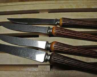Set knives (4), handle fake deer antler.