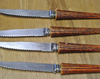 Knife set (4)Sheffield, handle fake deer antlers, England.