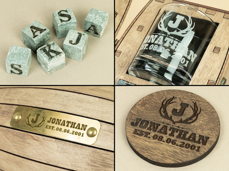 May include: A wooden box containing a glass whiskey tumbler, a coaster, and a set of whiskey stones. The box is engraved with the name "Jonathan" and the date "EST. 08.06.2001".