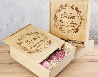 May include: Two wooden boxes with lids, each with a personalised engraved message. The top box says "Chloe Maid of Honour June 12, 2025" and the bottom box says "Sophia Bridesmaid June 12, 2025".