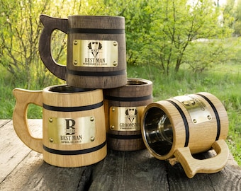 May include: Four wooden beer mugs with personalised engraved metal plates. The mugs are made of wood with a black band around the top. The plates have a black tuxedo graphic and the text "Best Man" and the date of the wedding.
