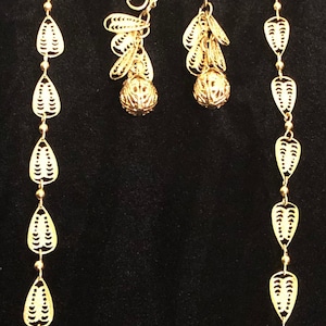 Trifari TM gold plated necklace with drop and dangling clip earrings