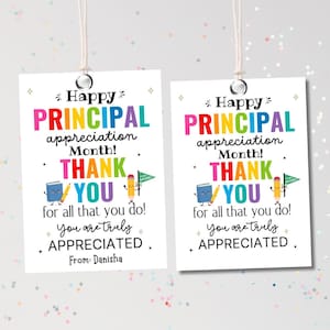 May include: Two white gift tags with the text "Happy Principal Appreciation Month! Thank You" in colorful letters. The tags have illustrations of a book, pencil, and flag. The text "You are truly appreciated" is also included.