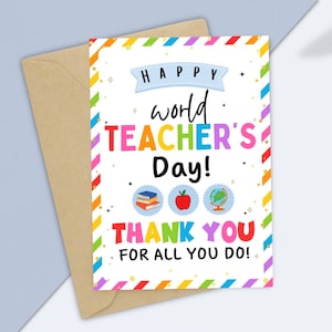 May include: A vibrant World Teacher's Day card with a brown envelope. The card displays the message "HAPPY WORLD TEACHER'S DAY! THANK YOU FOR ALL YOU DO!" alongside illustrations of books, an apple, and a globe.