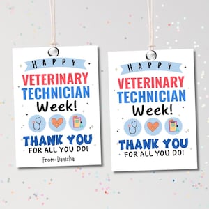 May include: Two white rectangular gift tags with the text "HAPPY VETERINARY TECHNICIAN Week! THANK YOU FOR ALL YOU DO!" in blue and red. The tags have a stethoscope, heart, and clipboard graphic. The tags are hanging by a white string.